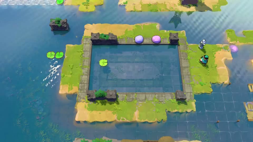 A square pool enclosed by stone-edged land, with pink and blue stones along its upper side, one pad inside and a pair of pads outside the left edge.